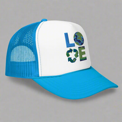 LOVE Earth Day Foam Trucker Hat, which features the letters L-O-V-E in large embroidered block letters in shades of blue and green. The hat is teal and white. The letters each represent water, earth, recycling and nature. by jaecrece.com