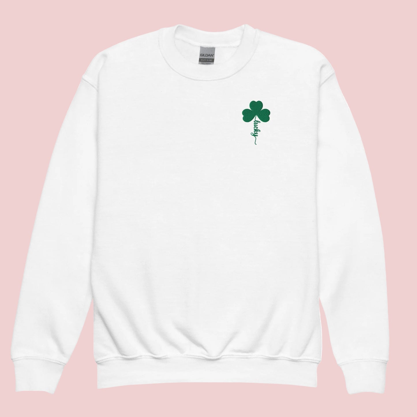 White Gildan 18000B youth sweatshirt featuring lucky shamrock embroidery with a green four leaf clover and script “Lucky” stem design. This embroidered St Patrick’s Day sweatshirt is designed for kids festive outfits, school celebrations, and March holiday events. The soft fleece interior and classic crewneck fit make it a comfortable and cozy option for everyday wear. Perfect for boys and girls celebrating St Patrick’s Day and coordinating matching family St Patrick’s Day outfits.