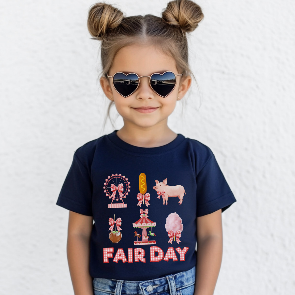 Cute girls fair shirt featuring fluffy pink cotton candy, a Ferris wheel, carousel, corn dog, caramel apple and pink pig. Coordinating gingham bows and FAIR DAY lettering create a sweet nostalgic look for her next trip to the fair.