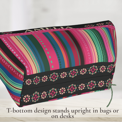 Personalized serape inspired makeup bag showing the T bottom construction that allows the colorful cosmetic and toiletry pouch to stand upright on a flat surface, with a structured base for convenient access to makeup, toiletries, skincare and travel essentials