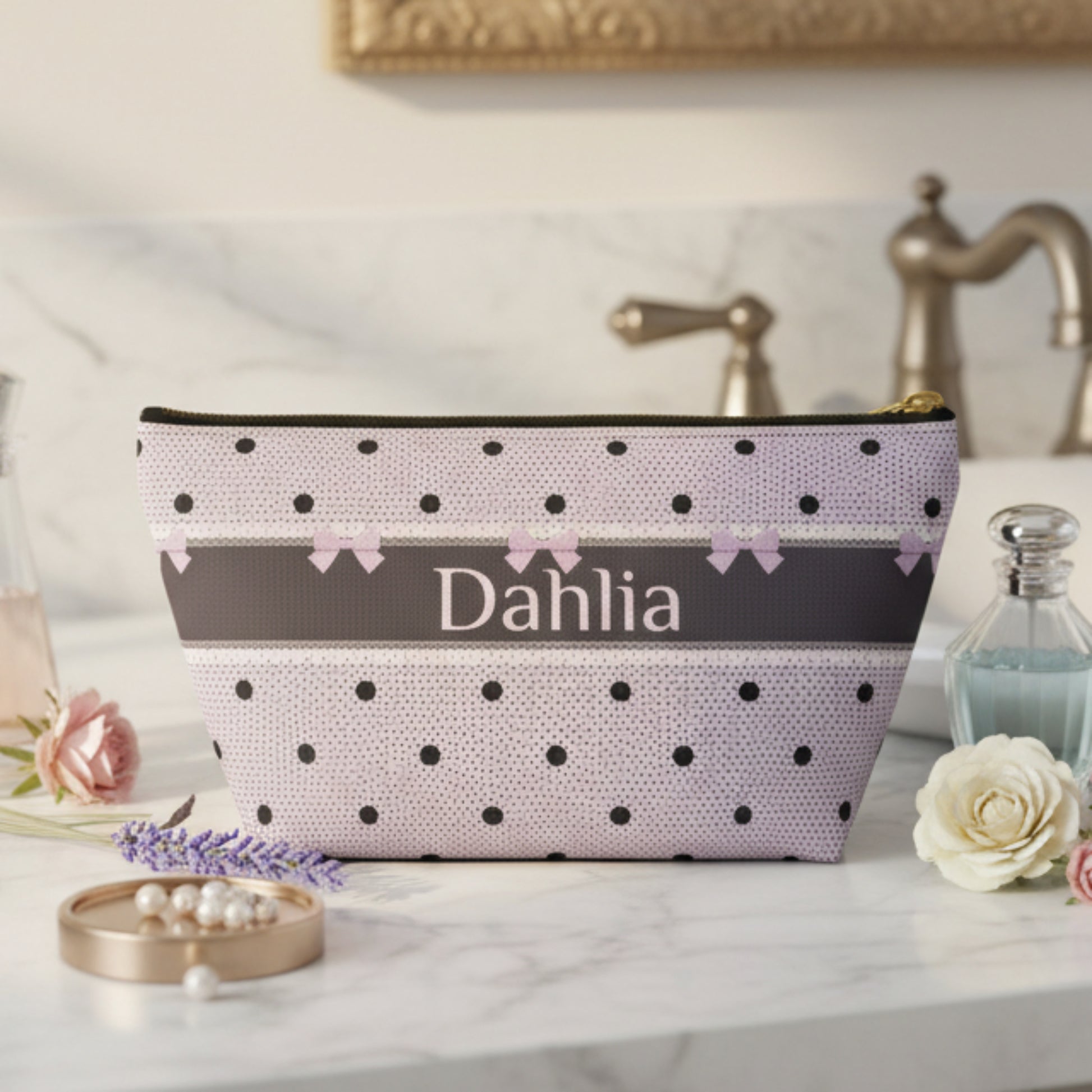 Lavender and black makeup bag with a romantic dark romance design featuring bows, polka dots, delicate lace inspired details and personalized lettering. This canvas zipper pouch makes a beautiful travel accessory for cosmetics, skincare and toiletries while bringing a gothic coquette aesthetic to your everyday routine.
