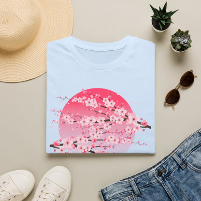 Folded light blue women's cherry blossom t shirt with pink sakura floral graphic, Japanese aesthetic design, styled with a straw sun hat, sunglasses, white sneakers and jeans