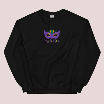 Bring home the spirit of New Orleans with this cozy Mardi Gras sweatshirt for adults. Featuring detailed embroidery of a Carnival mask in purple, green, and gold and festive “Mardi Gras” text, this top is great for NOLA lovers, parade-goers, or themed parties. Available in sizes S–5XL, it’s perfect for matching family outfits and French Quarter fashion.