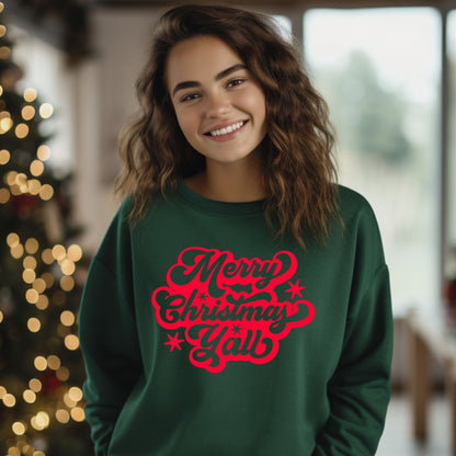 Girl wearing a forest green Christmas sweatshirt with red script that says “Merry Christmas Y’all,” standing in front of a decorated Christmas tree. Girls holiday sweatshirt for Christmas family outfits, matching family Christmas shirts, and festive holiday photos.