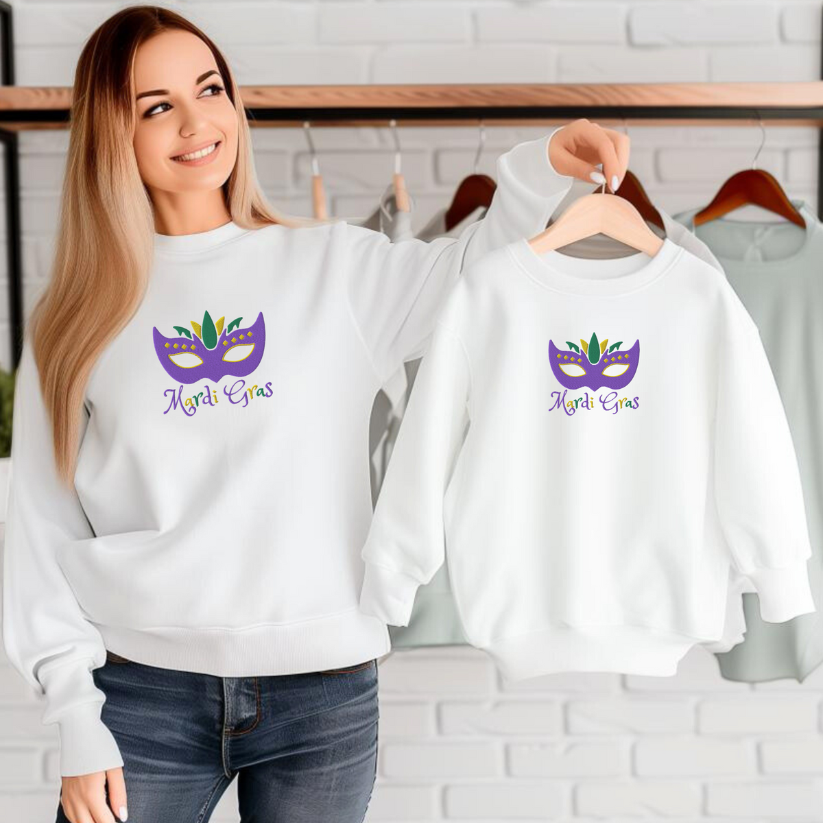 Featuring an embroidered purple, green, and gold carnival mask with the phrase “Mardi Gras,” this youth sweatshirt is a festive favorite. Available in XS–XL, it’s ideal for school events, parades, or family celebrations. It also matches adult sizes for coordinated holiday outfits. This kids Mardi Gras shirt is perfect for those searching for holiday sweatshirts, carnival clothing, or festive kidswear.