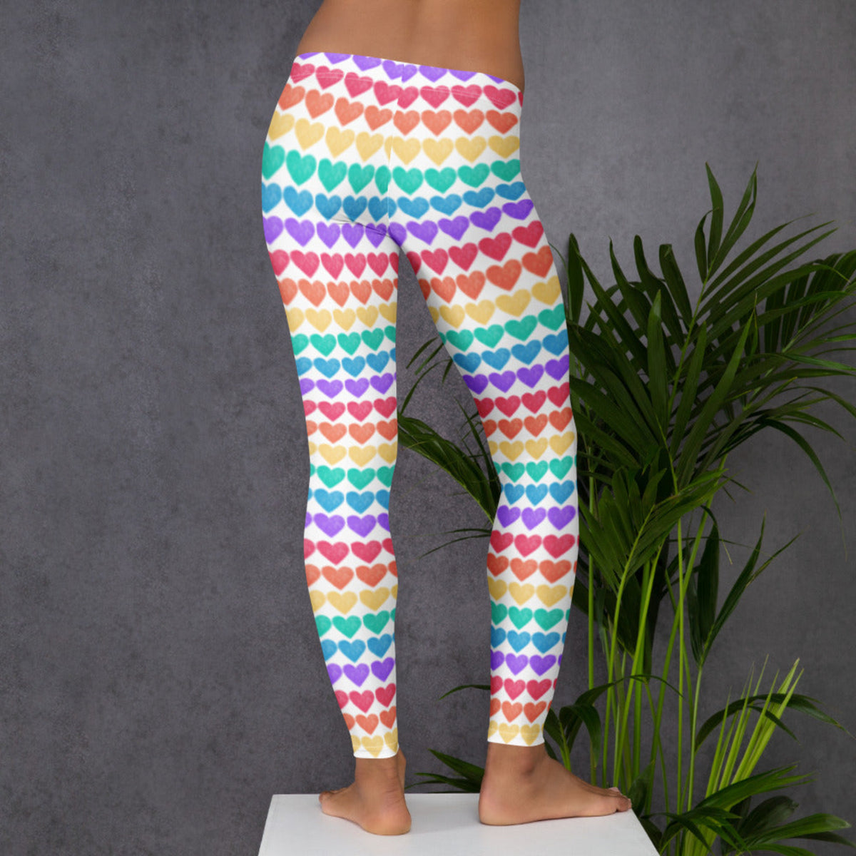 Celebrate love, inclusivity, and fun in our Women’s Rainbow Hearts Leggings. With full-length legs, a mid rise waist, and rows of rainbow-colored hearts, these leggings offer both comfort and standout style. Perfect for colorful holidays, runs, and family photo ops. Stretchy microfiber fabric ensures they move with you—and matching sets for toddlers and youth complete the rainbow!