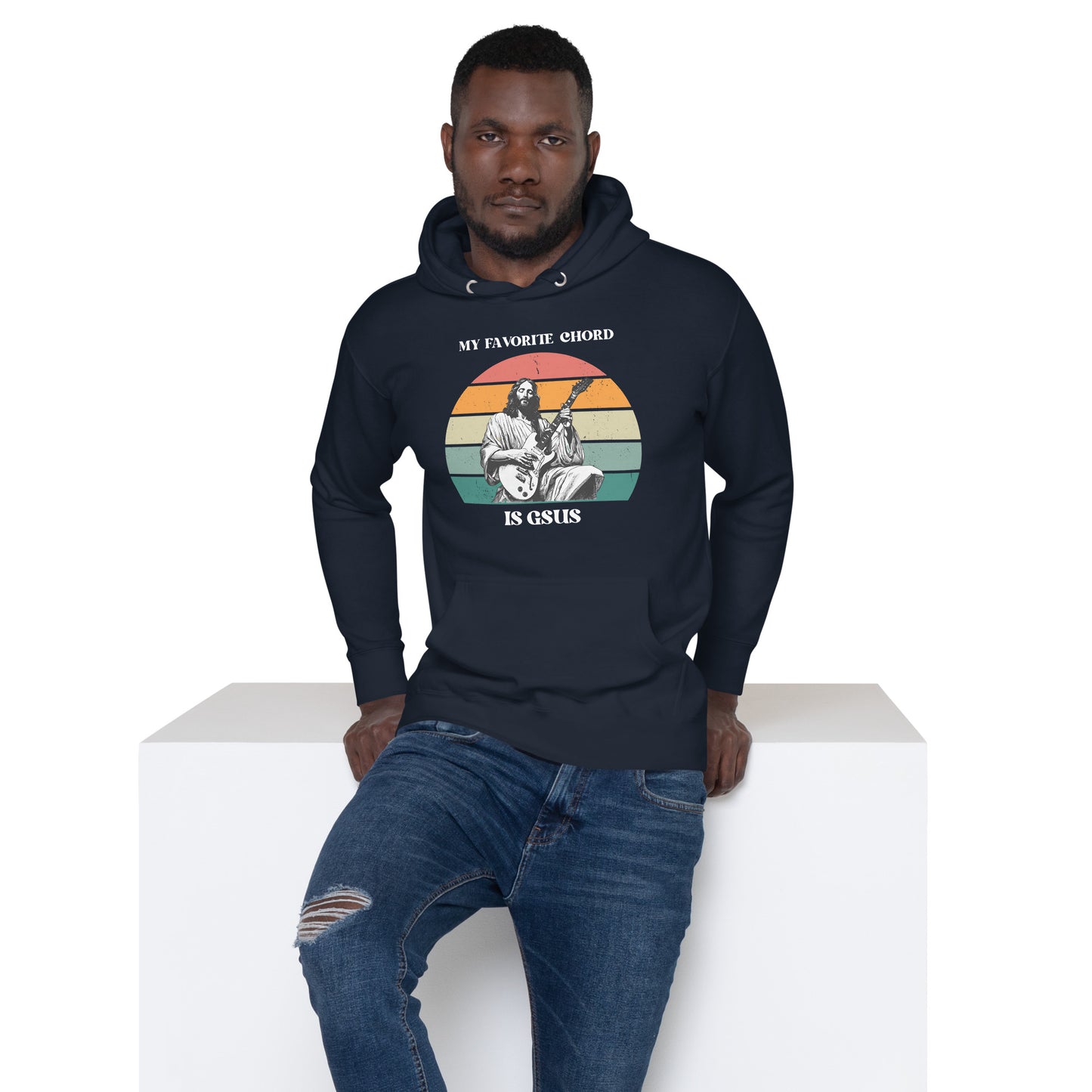 Adult wearing the “My Favorite Chord Is GSUS” hoodie, showcasing a humorous Christian music pun. This soft fleece unisex hoodie is designed for guitarists, choir members, and worship teams who want comfort and style. With an inclusive size range from small to 3XL, it’s a perfect gift for musicians who appreciate faith-inspired humor.