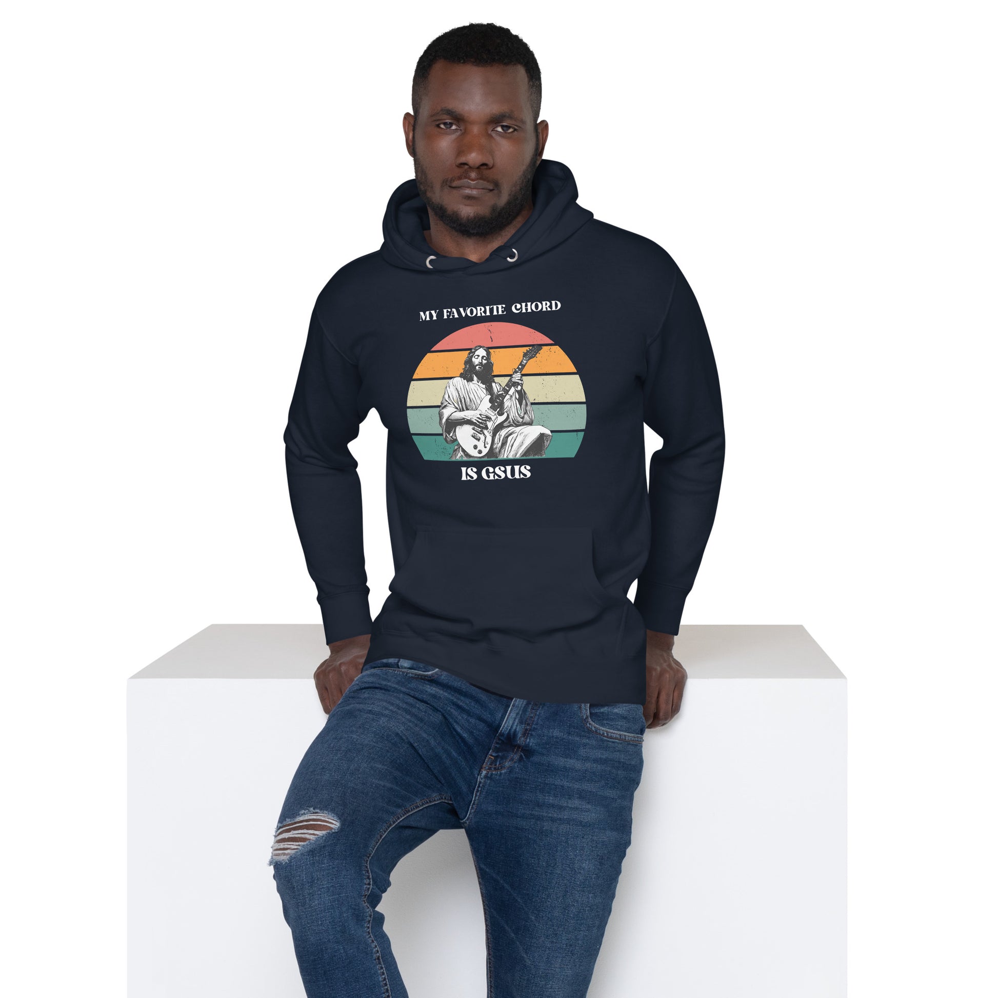 Adult wearing the “My Favorite Chord Is GSUS” hoodie, showcasing a humorous Christian music pun. This soft fleece unisex hoodie is designed for guitarists, choir members, and worship teams who want comfort and style. With an inclusive size range from small to 3XL, it’s a perfect gift for musicians who appreciate faith-inspired humor.