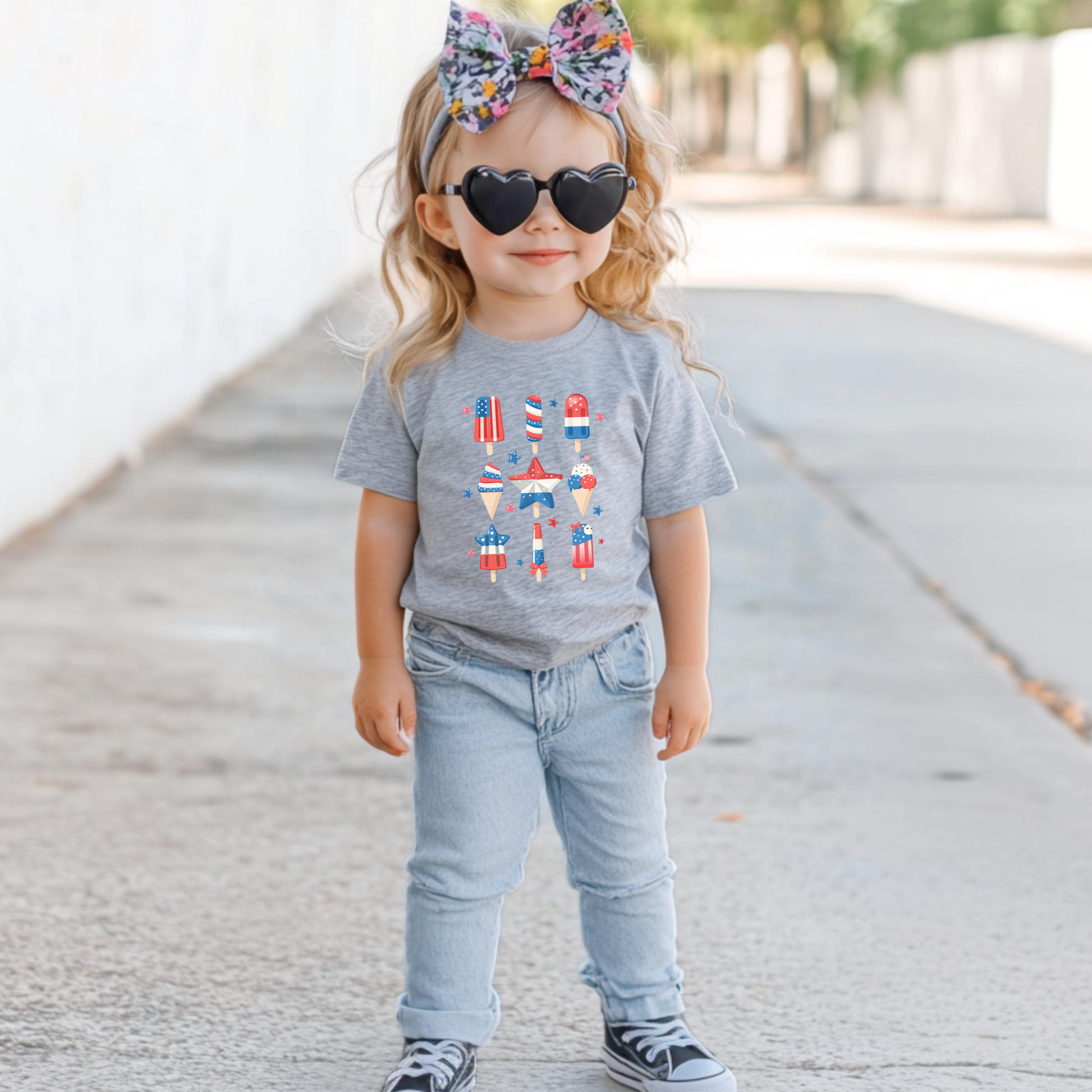 Image: Celebrate the holiday with a toddler patriotic popsicle shirt in red white and blue. This fun and festive tee is designed with comfort and American pride in mind, making it the perfect Fourth of July shirt for toddlers. Ideal for Memorial Day picnics, summer playdates, or matching family outfits, this cute toddler tee helps your little one shine at any patriotic event, by jaecrece.