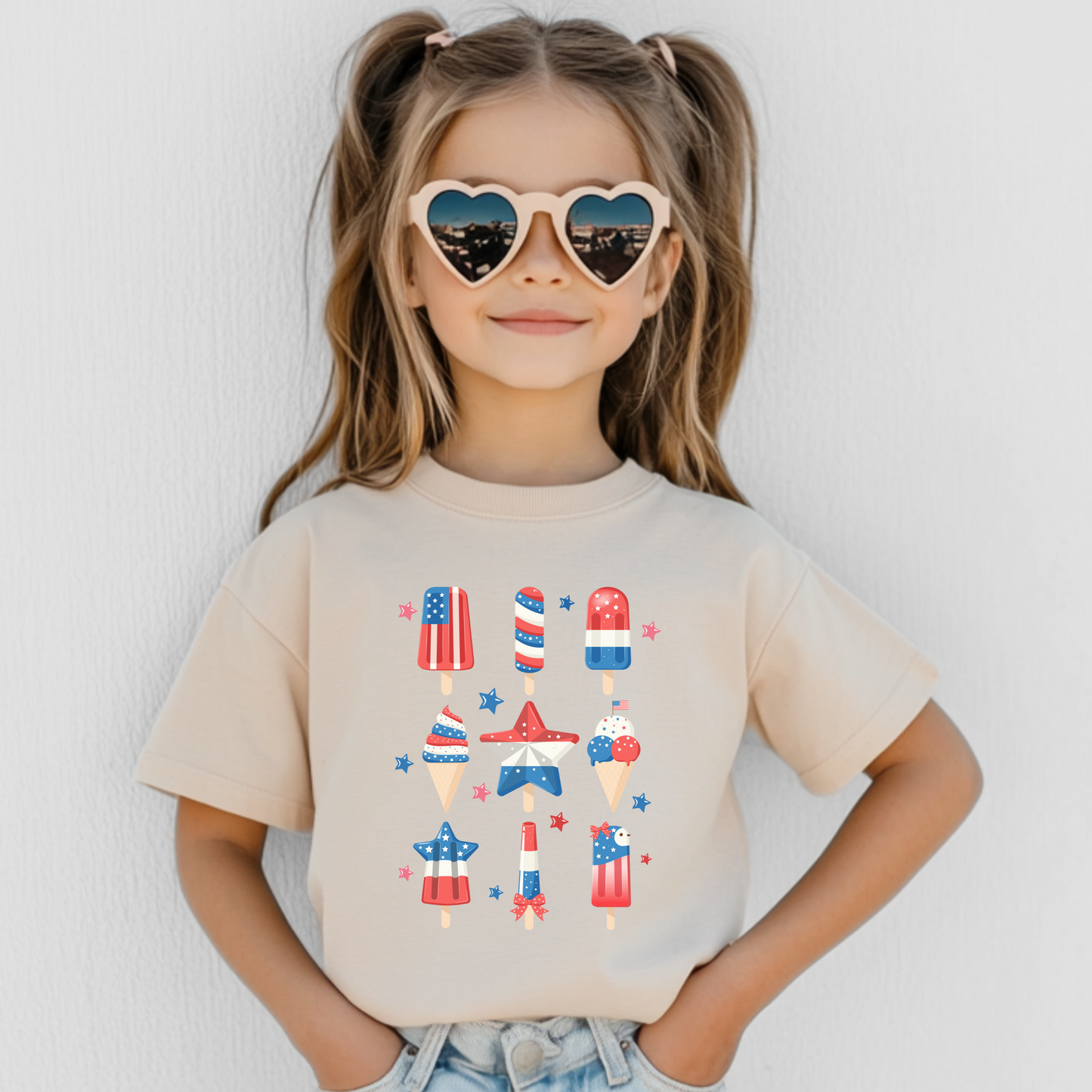 Image: Red white and blue toddler tee with a cheerful popsicle print, designed for Fourth of July, Memorial Day, or any USA-themed family gathering. This Independence Day toddler shirt is great for patriotic parties, photo ops, and fun matching sibling sets. The perfect gift for toddlers who love to show off their stars and stripes style all summer long, by jaecrece.