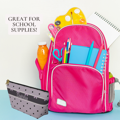 Personalized school supplies pouch featuring a lavender and black gothic coquette design with bows, polka dots and lace inspired details. This canvas zipper pouch can hold pencils, pens, erasers and other small classroom essentials. Customize it with a name or initials for a practical and stylish school accessory that also makes a fun tween girl gift.
