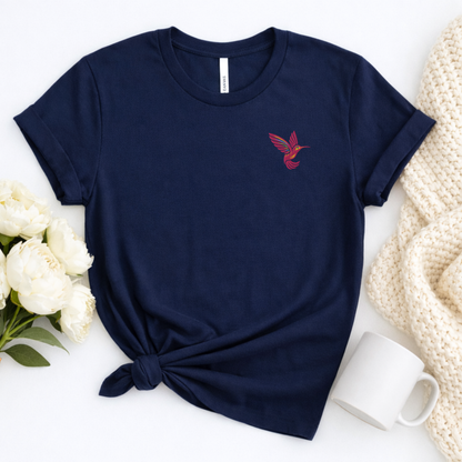 Women's hummingbird embroidered shirt featuring a delicate pink hummingbird stitched on the left chest, available in cream, pink, white, forest green and navy, a beautiful nature inspired tee for hummingbird lovers, bird lovers, gardeners and everyday casual outfits