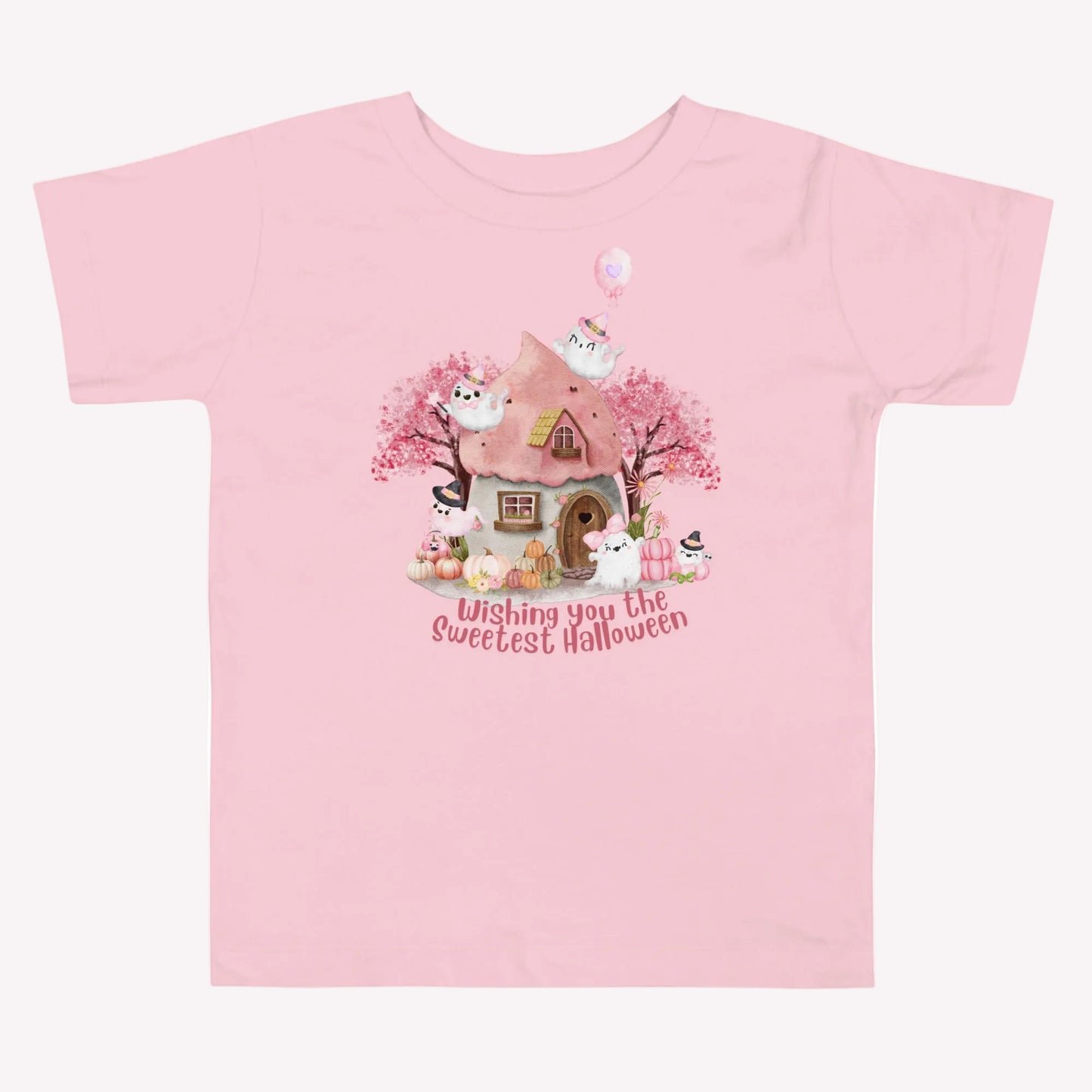 Pink Halloween toddler shirt with smiling and playful ghosts, pastel pumpkins, flowers, autumn trees, and a charming haunted cottage. The phrase Wishing You the Sweetest Halloween is featured in large pink lettering for a cheerful and whimsical Halloween look.