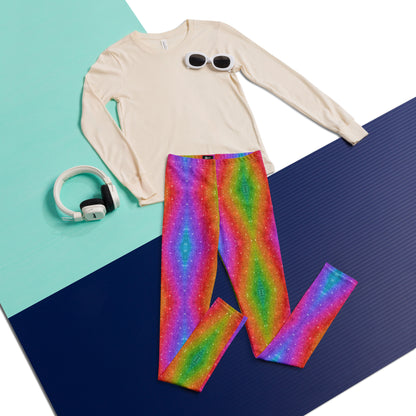 Flat lay showing the complete pair of rainbow glitter holographic swirl leggings, featuring a bold multicolor swirling pattern with a faux glitter effect and vibrant rainbow colors. The full length girls leggings have a high rise elastic waistband and soft four way stretch fabric designed for comfortable movement. Available in toddler and tween sizes 2T–20, these colorful leggings are perfect for dance, play, school, festivals, parties, parades, and everyday outfits.