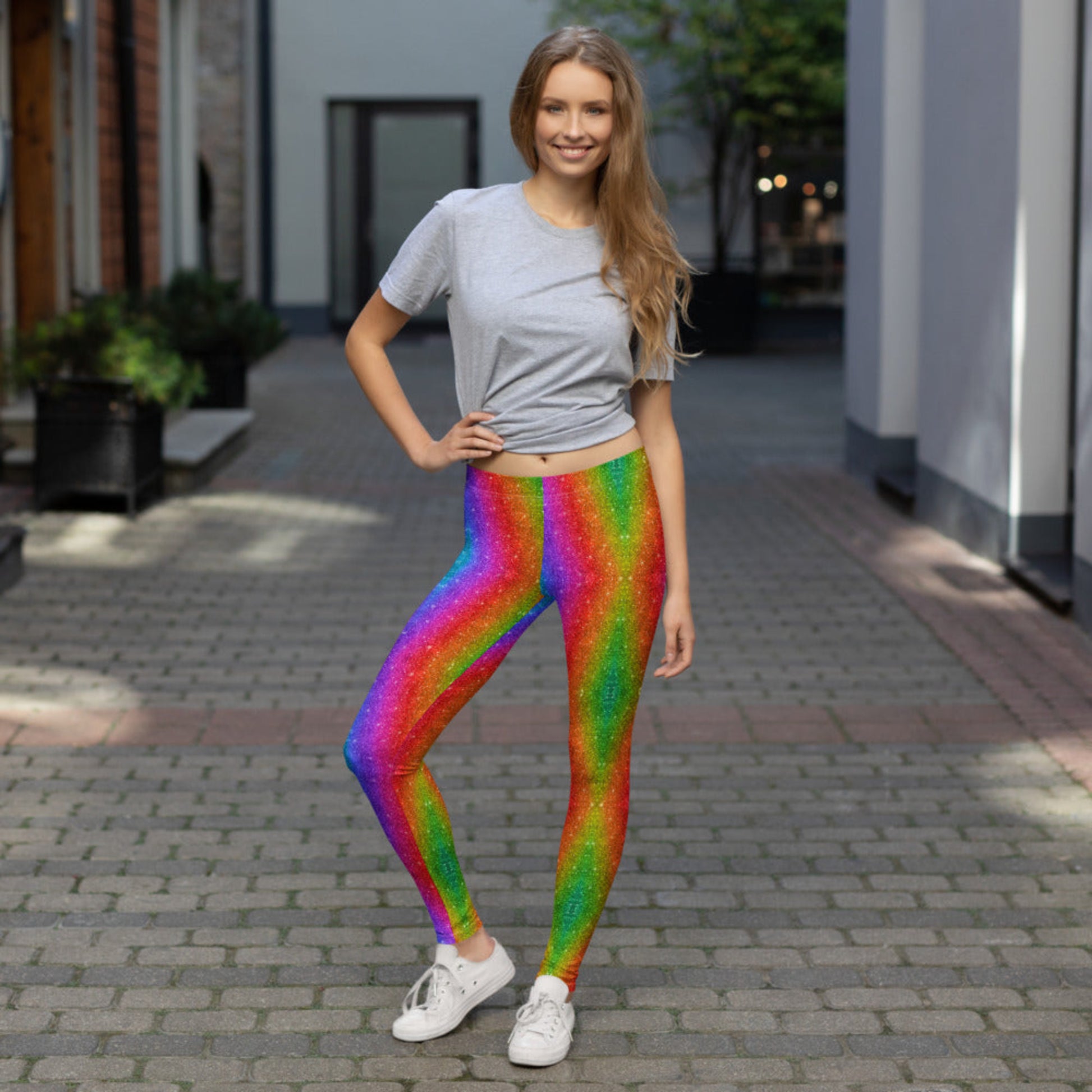 Make a bold statement in rainbow swirl glitter leggings for women, great for LGBTQ+ celebrations, 5K runs, Mardi Gras, or music festivals. These vibrant full-length leggings offer a flattering mid-rise cut and four-way stretch. Ideal for matching family sets or standalone looks, these leggings are equal parts fun and functional, with a colorful print that shines without actual glitter.