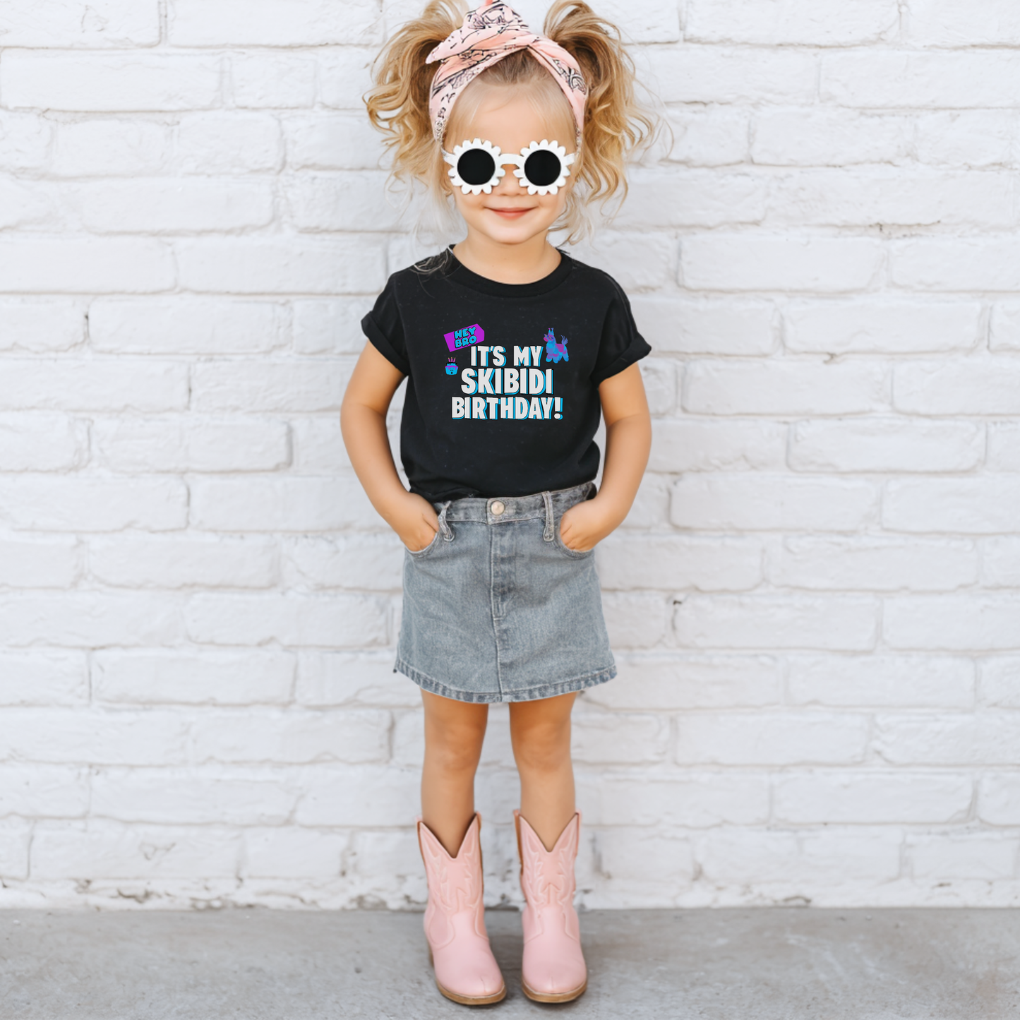 Toddler birthday graphic tee featuring the It’s My Skibidi Birthday message with colorful playful graphics and bold blue and white lettering, making a funny birthday shirt for a Gen Alpha toddler celebration