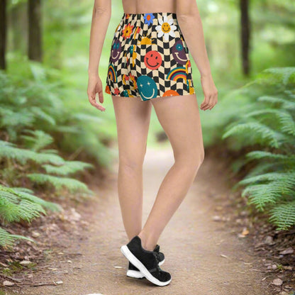 Back view of unisex smiley face checkerboard workout shorts displaying the full retro wavy checker design with smiley face details across breathable fast drying fabric. Designed for comfort and performance, these athletic shorts include an elastic waistband, moisture wicking microfiber material, and a lightweight feel that makes them perfect for gym training, running, lounging, and coordinating with matching family leggings for fun group outfits.