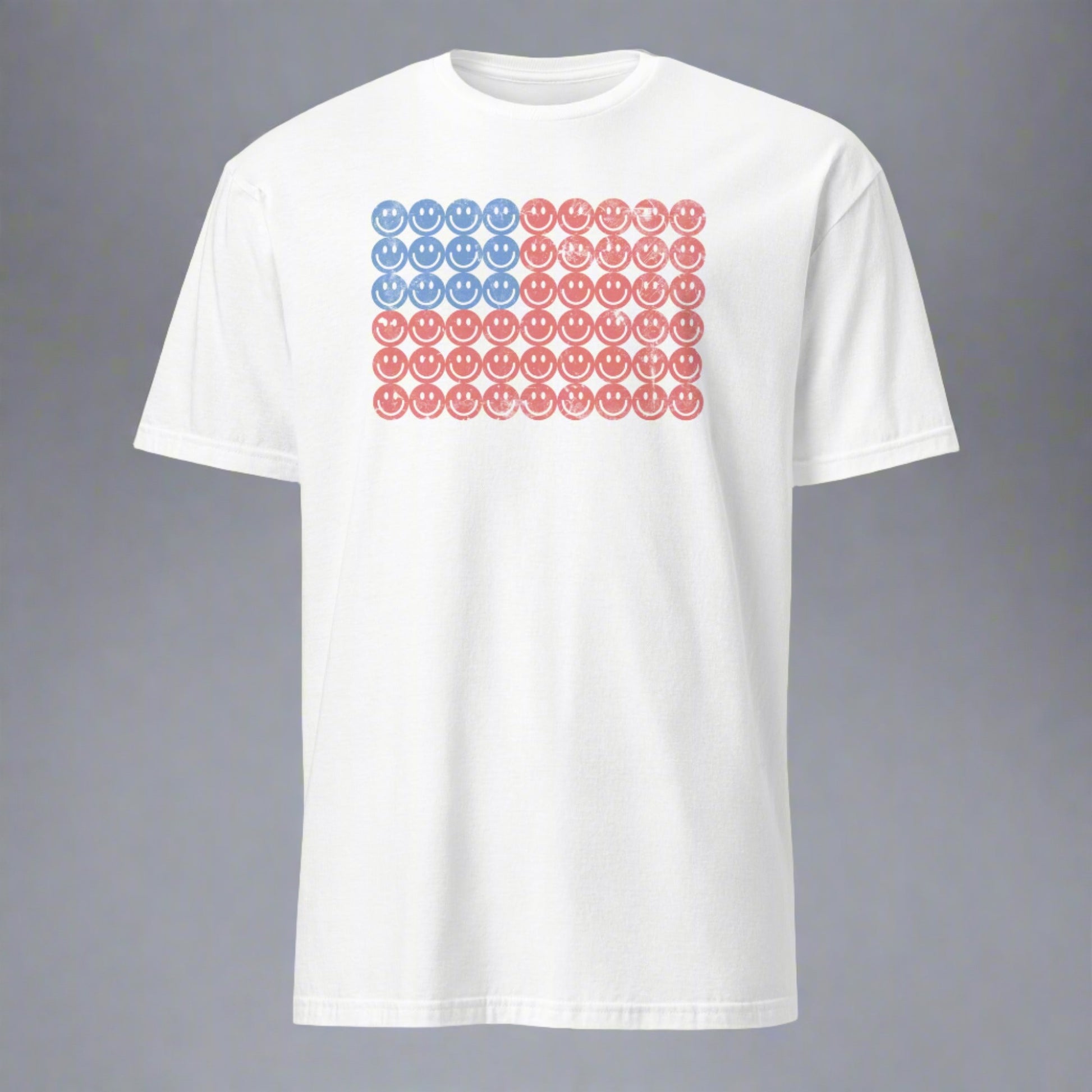 White adult tshirt, featuring a Fourth of July pattern of red and blue smiley faces which form an American flag. by jaecrece.com