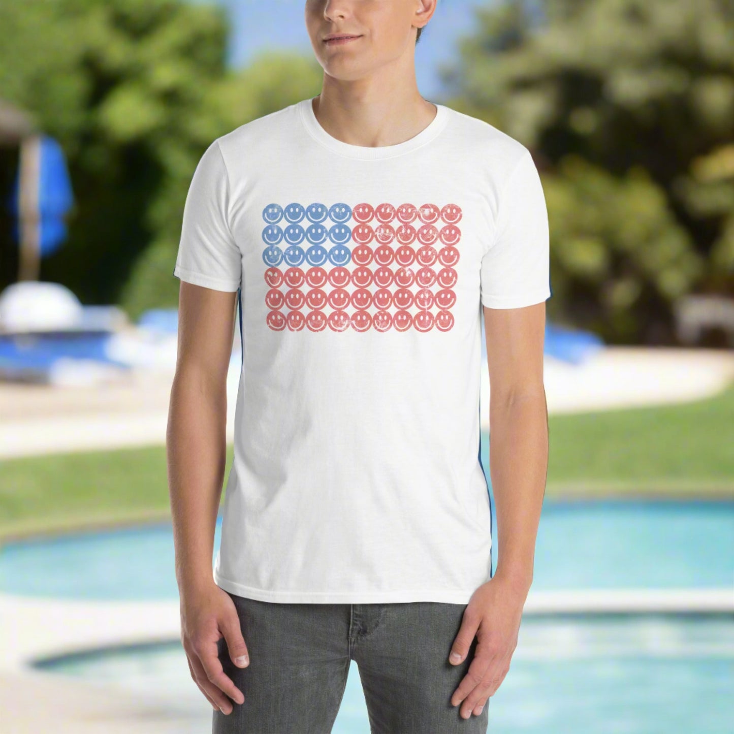 White adult tshirt, featuring a Fourth of July pattern of red and blue smiley faces which form an American flag. by jaecrece.com