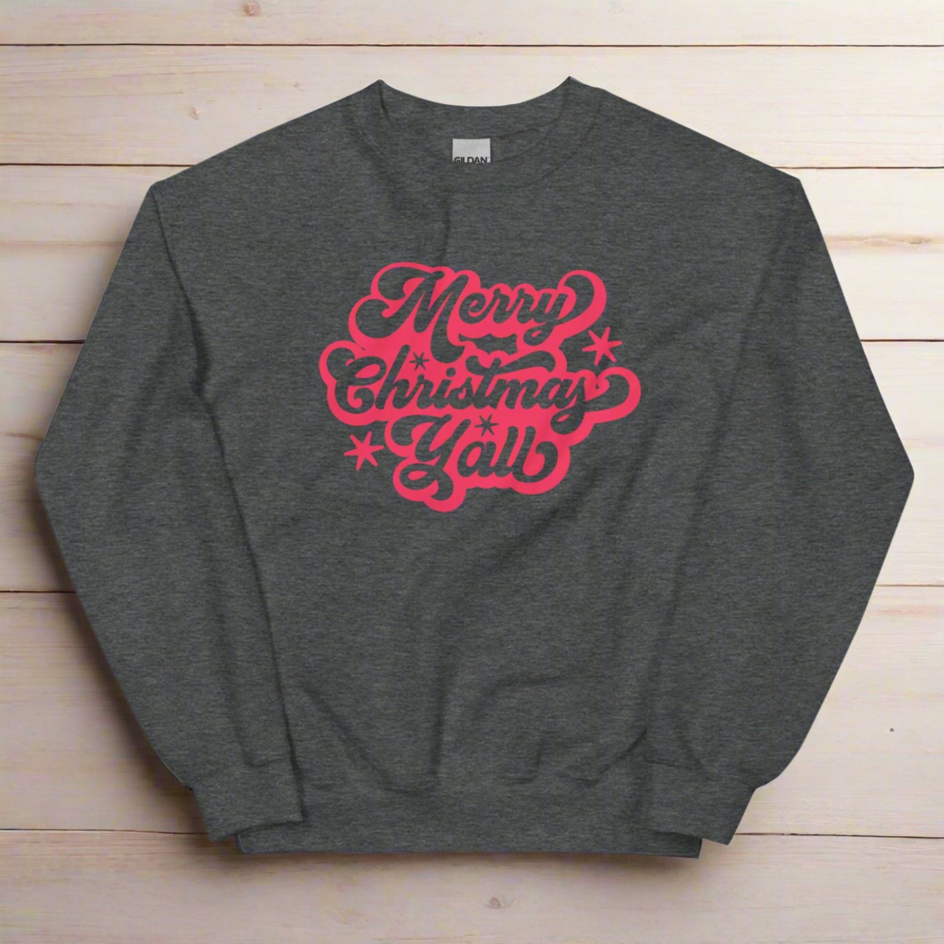 Merry Christmas Y'all Unisex Holiday Adult Sweatshirt, featuring large cursive script with reads Merry Christmas Y'all in red lettering. The perfect Southern Christmas gift or present, extended/ plus size available. by jaecrece