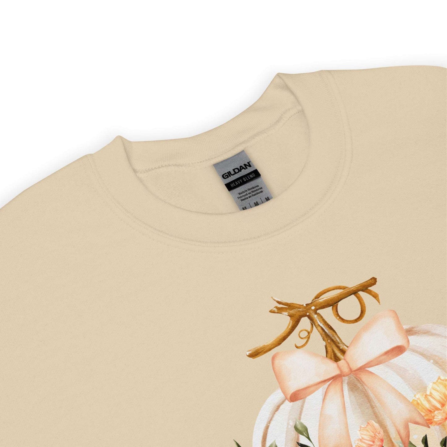 Fall Love Ladies Sweatshirt, this is a Sand colored Gildan Sweatshirt, with a graphic of a white pumpkin with a peach ribbon. The pumpkin is surrounded by a garland of fall leaves and flowers, with the text- Fall Love, by jaecrece