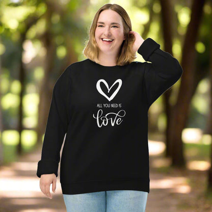 All You Need is Love Organic Sweatshirt. Image features a white heart, and the text "All You Need is Love"