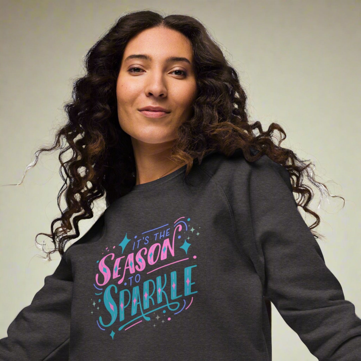 100% organic cotton sweatshirt that reads "it's the season to sparkle" in pink and teal lettering. Extended/ plus size available. By jaecrece.com