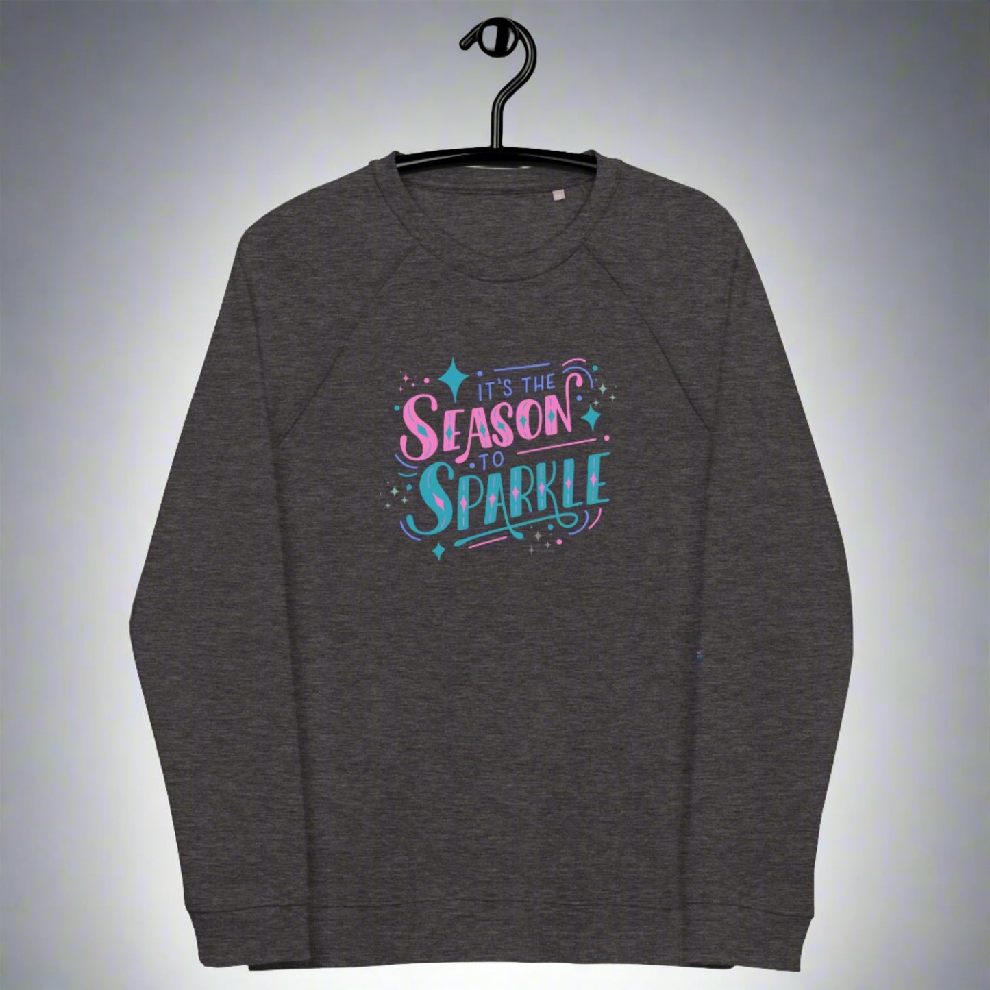 100% organic cotton sweatshirt that reads "it's the season to sparkle" in pink and teal lettering. Extended/ plus size available. By jaecrece.com