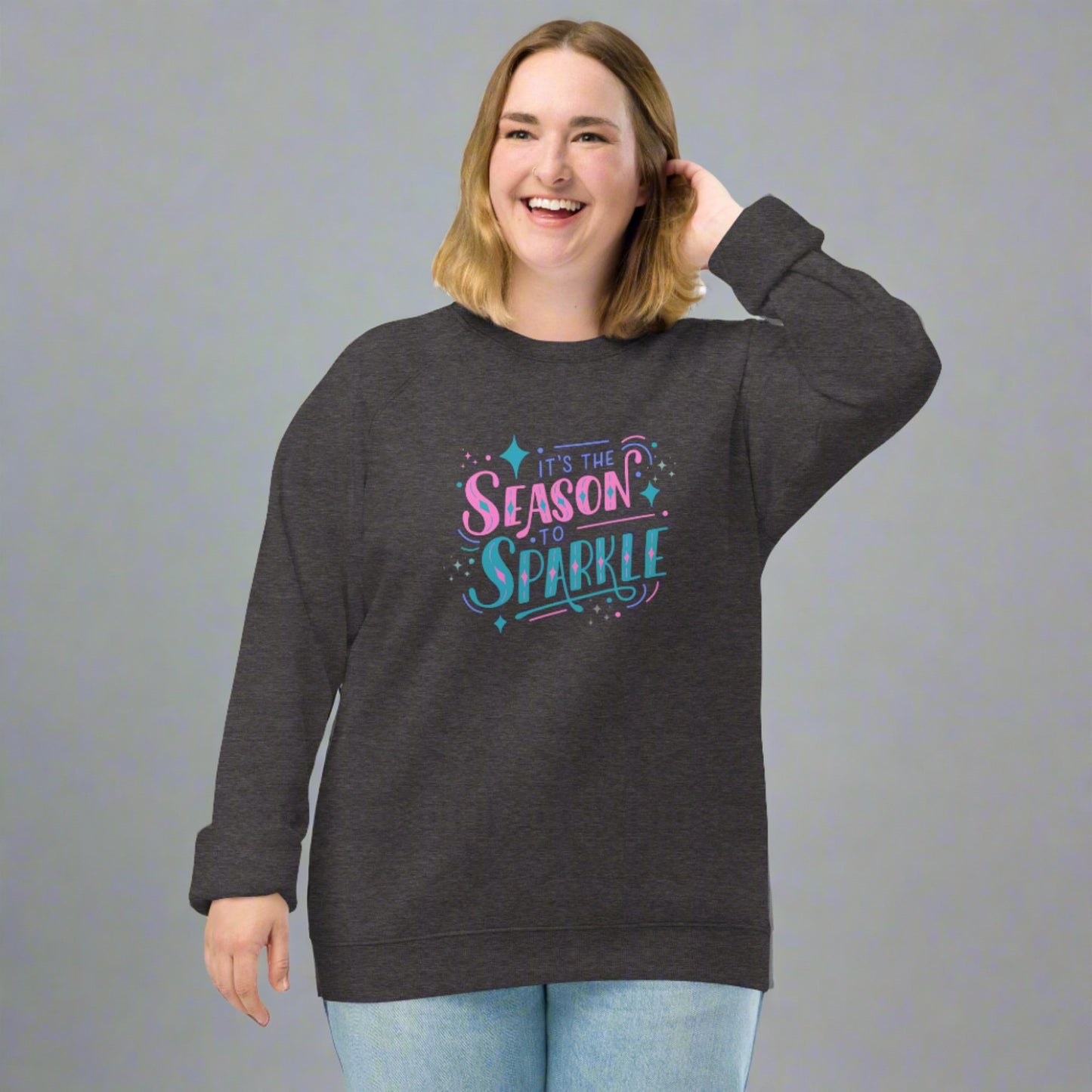 100% organic cotton sweatshirt that reads "it's the season to sparkle" in pink and teal lettering. Extended/ plus size available. By jaecrece.com