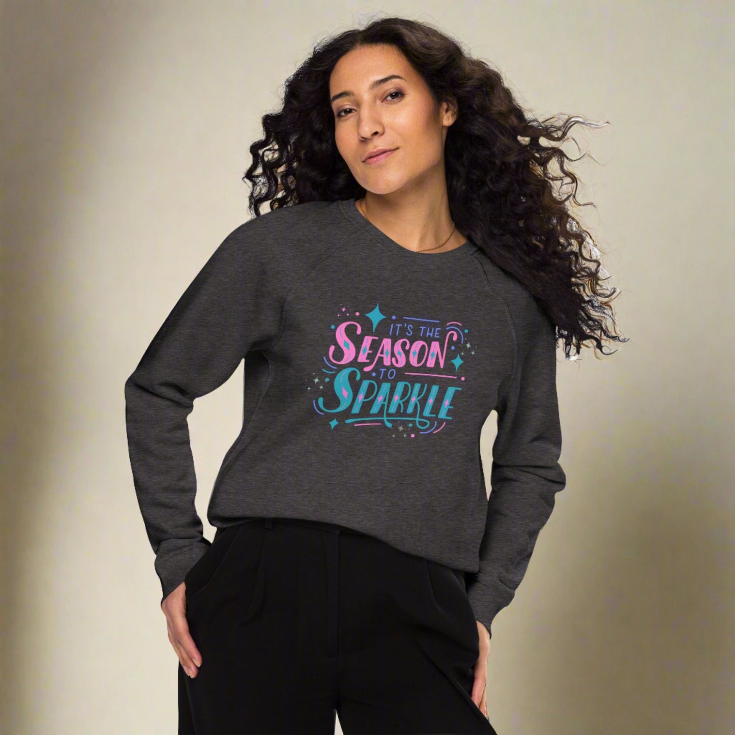 100% organic cotton sweatshirt that reads "it's the season to sparkle" in pink and teal lettering. Extended/ plus size available. By jaecrece.com