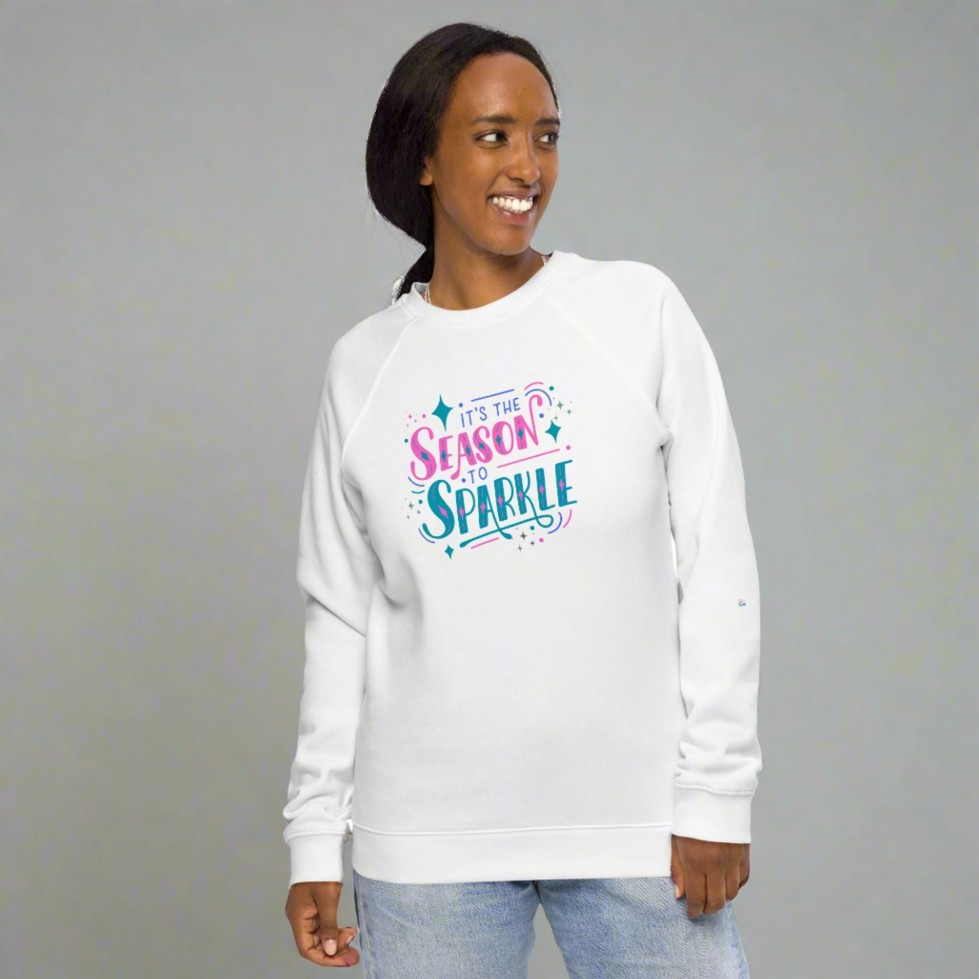 100% organic cotton sweatshirt that reads "it's the season to sparkle" in pink and teal lettering. Extended/ plus size available. By jaecrece.com