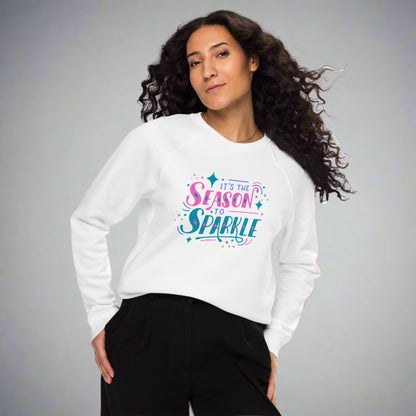 100% organic cotton sweatshirt that reads "it's the season to sparkle" in pink and teal lettering. Extended/ plus size available. By jaecrece.com