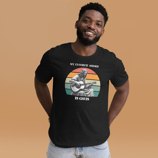 Funny musician t-shirt featuring the phrase “My Favorite Chord Is GSUS,” a clever play on the Gsus guitar chord. This soft unisex shirt is perfect for guitar players, music teachers, and band members with a sense of humor. Made from lightweight cotton and available in plus sizes, it’s a witty way to show off your love for music and puns, whether on stage, in rehearsal, or just jamming with friends.