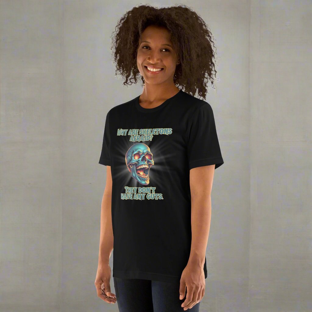 Black adult Unisex Halloween tee, featuring a large graphic of a laughing skeleton skull. The text reads" Why are skeletons afraid? They don't have any guts."  by jaecrece.com