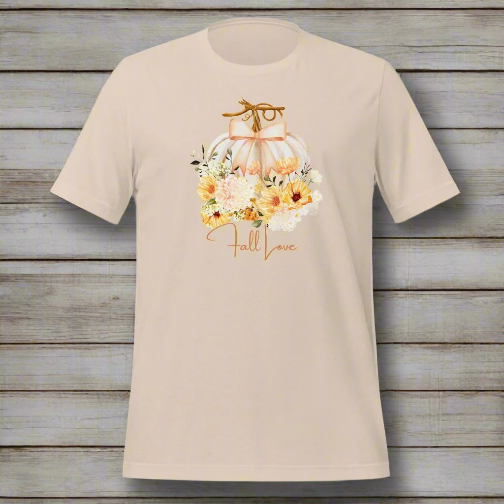 Fall Love Tshirt, featuring a white pumpkin with a peach ribbon, surrounded by fall flowers. The text reads fall, love, by jaecrece.