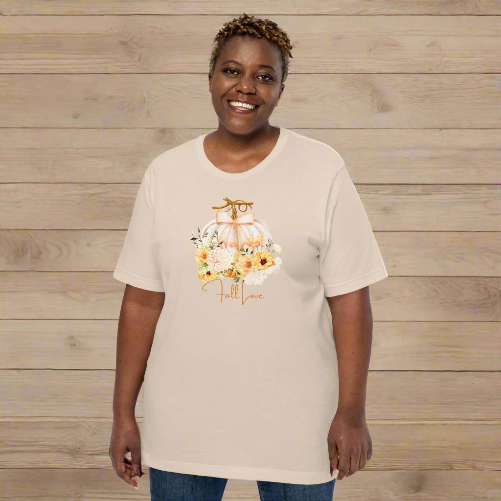 Fall Love Tshirt, featuring a white pumpkin with a peach ribbon, surrounded by fall flowers. The text reads fall, love, by jaecrece.