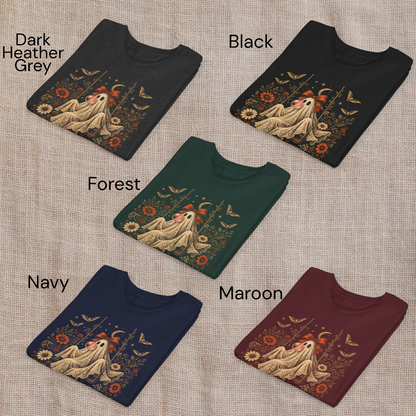 Girls Halloween T shirts shown folded in Black, Navy, Maroon, Forest Green and Dark Heather Grey. Each shirt features the whimsical vintage ghost blowing bubble gum design with orange flowers, botanical foliage, bats, stars, lace and a bow, offering classic color choices for spooky season and fall outfits.