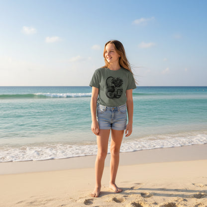 Comfort Colors mermaid t shirt featuring a linocut inspired illustration of a mermaid rising from textured ocean waves under a glowing full moon. Coastal aesthetic graphic tee on a soft garment dyed midweight unisex shirt with relaxed classic fit. Perfect ocean lover shirt beach outfit summer coastal style vintage seaside art tee for women men and teens. Ideal for layering or casual wear with durable cotton fabric and detailed monochrome artwork mermaid lover gift coastal gift idea