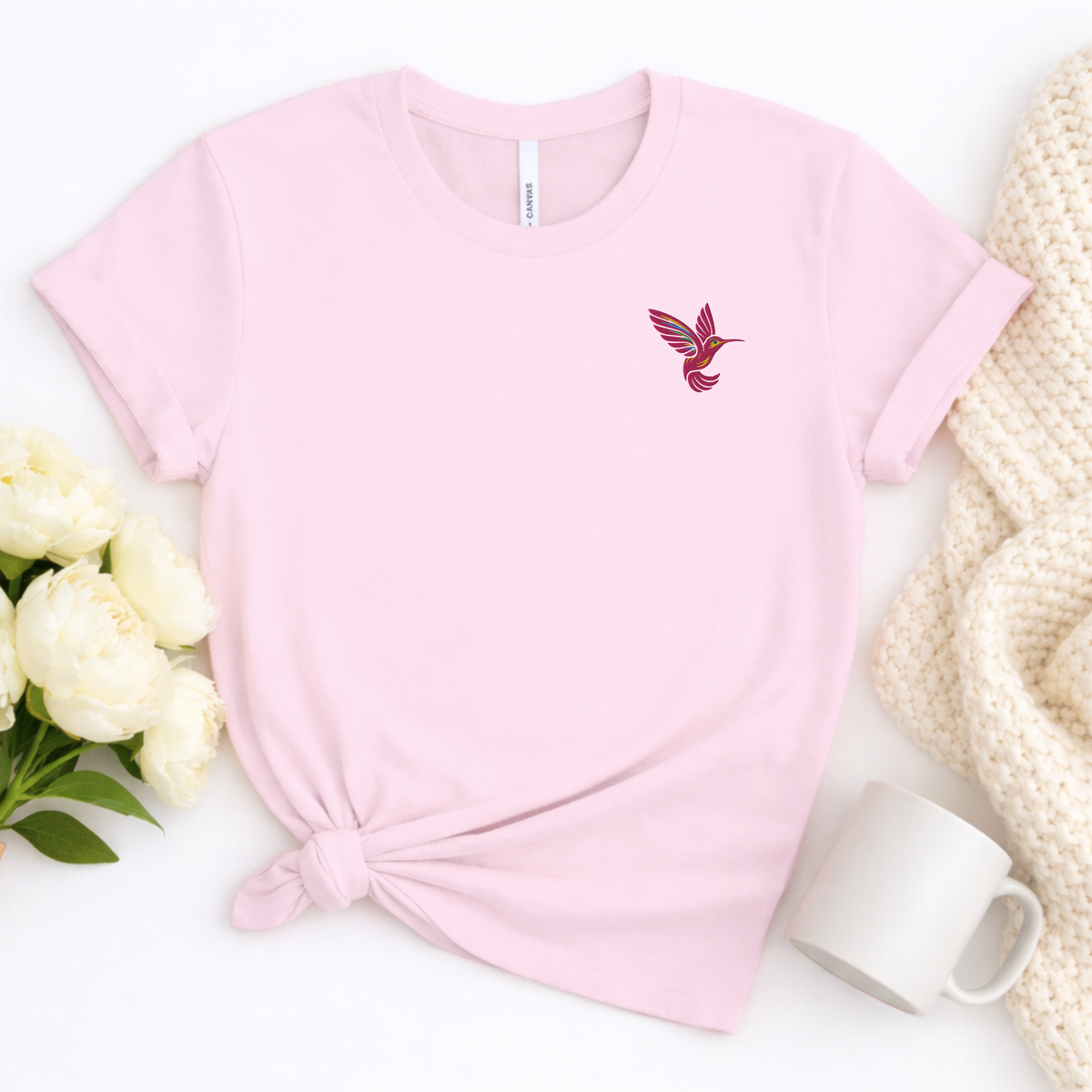 Women's embroidered hummingbird shirt with a bright pink bird design on the left chest, a simple nature lover tee available in multiple colors and sizes XS through 5XL, perfect for gardening, bird watching, botanical outings and everyday wear