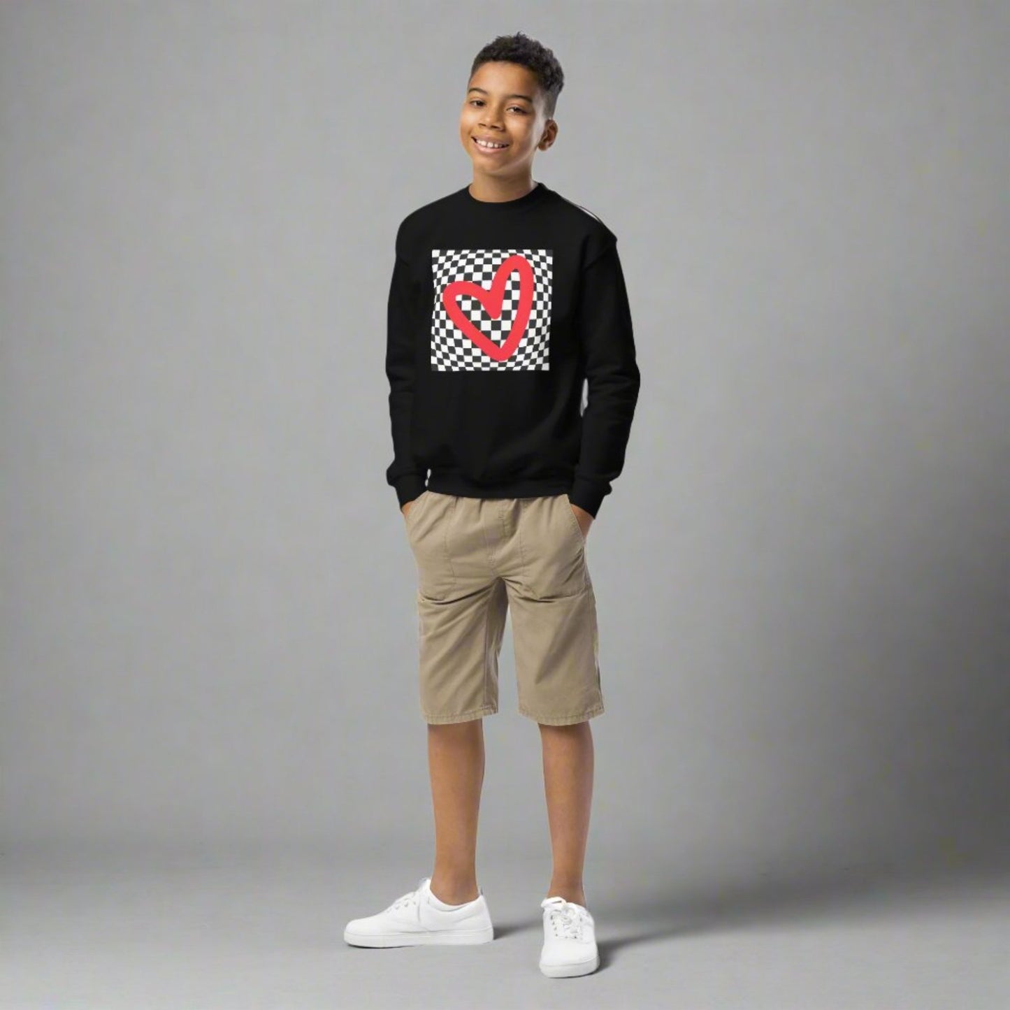 Checkerboard Love Youth Sweatshirt, features a retro black and checker optical illusion pattern with a red heart. Perfect as a gift for Valentine's Day! Matching shirts, baby bodysuits available in baby, child and adult sizes, by jaecrece
