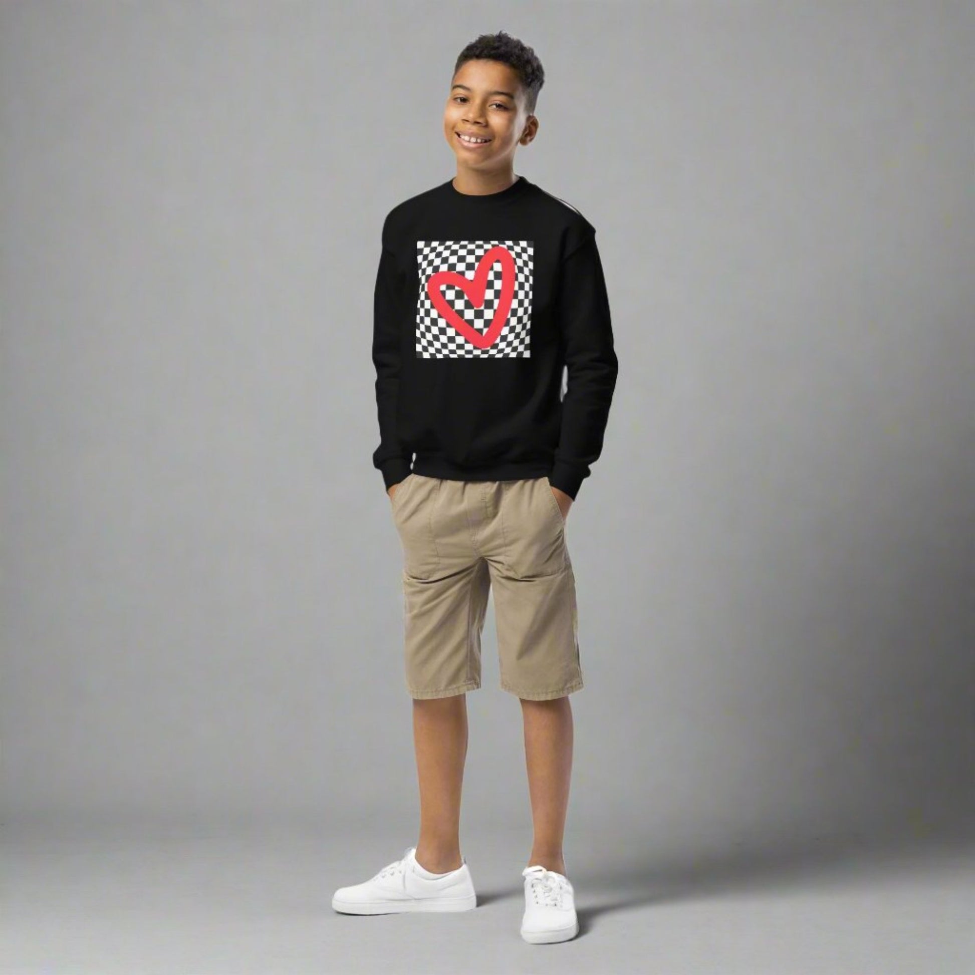 Checkerboard Love Youth Sweatshirt, features a retro black and checker optical illusion pattern with a red heart. Perfect as a gift for Valentine's Day! Matching shirts, baby bodysuits available in baby, child and adult sizes, by jaecrece