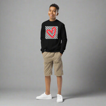 Checkerboard Love Youth Sweatshirt, features a retro black and checker optical illusion pattern with a red heart. Perfect as a gift for Valentine's Day! Matching shirts, baby bodysuits available in baby, child and adult sizes, by jaecrece