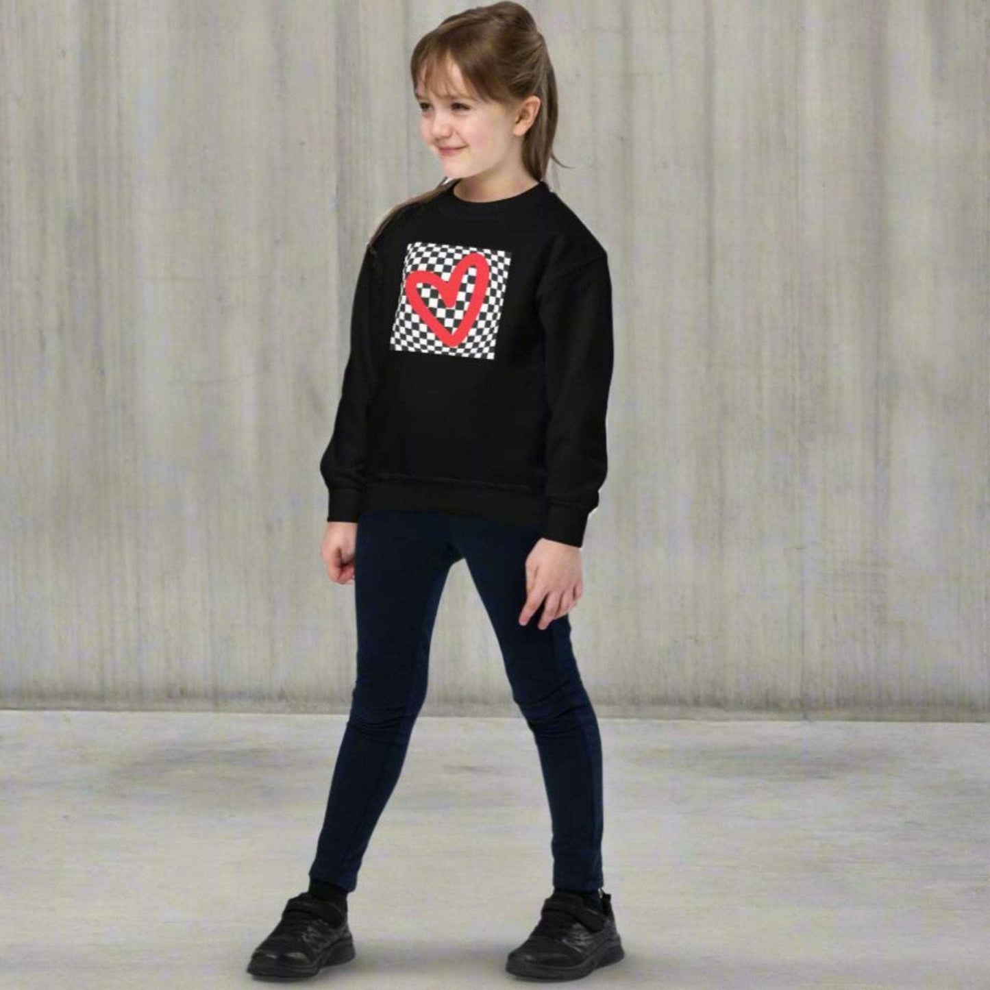 Checkerboard Love Youth Sweatshirt, features a retro black and checker optical illusion pattern with a red heart. Perfect as a gift for Valentine's Day! Matching shirts, baby bodysuits available in baby, child and adult sizes, by jaecrece