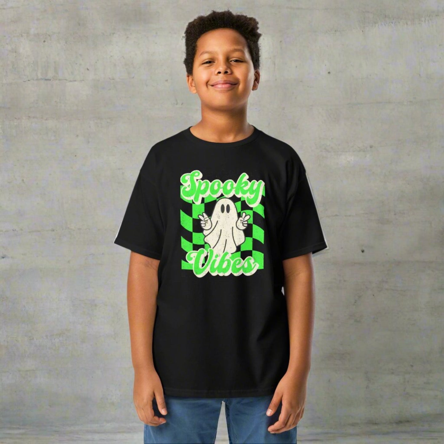 Black Spooky Vibes Child Shirt with a bright green checkerboard pattern and a cute ghost showing the peace sign. The text reads Spooky Vibes. This Halloween tee is perfect for girls and boys! By jaecrece