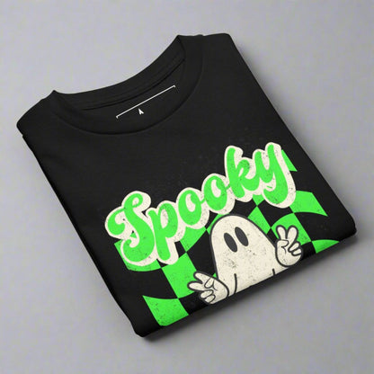 Black Spooky Vibes Child Shirt with a bright green checkerboard pattern and a cute ghost showing the peace sign. The text reads Spooky Vibes. This Halloween tee is perfect for girls and boys! By jaecrece