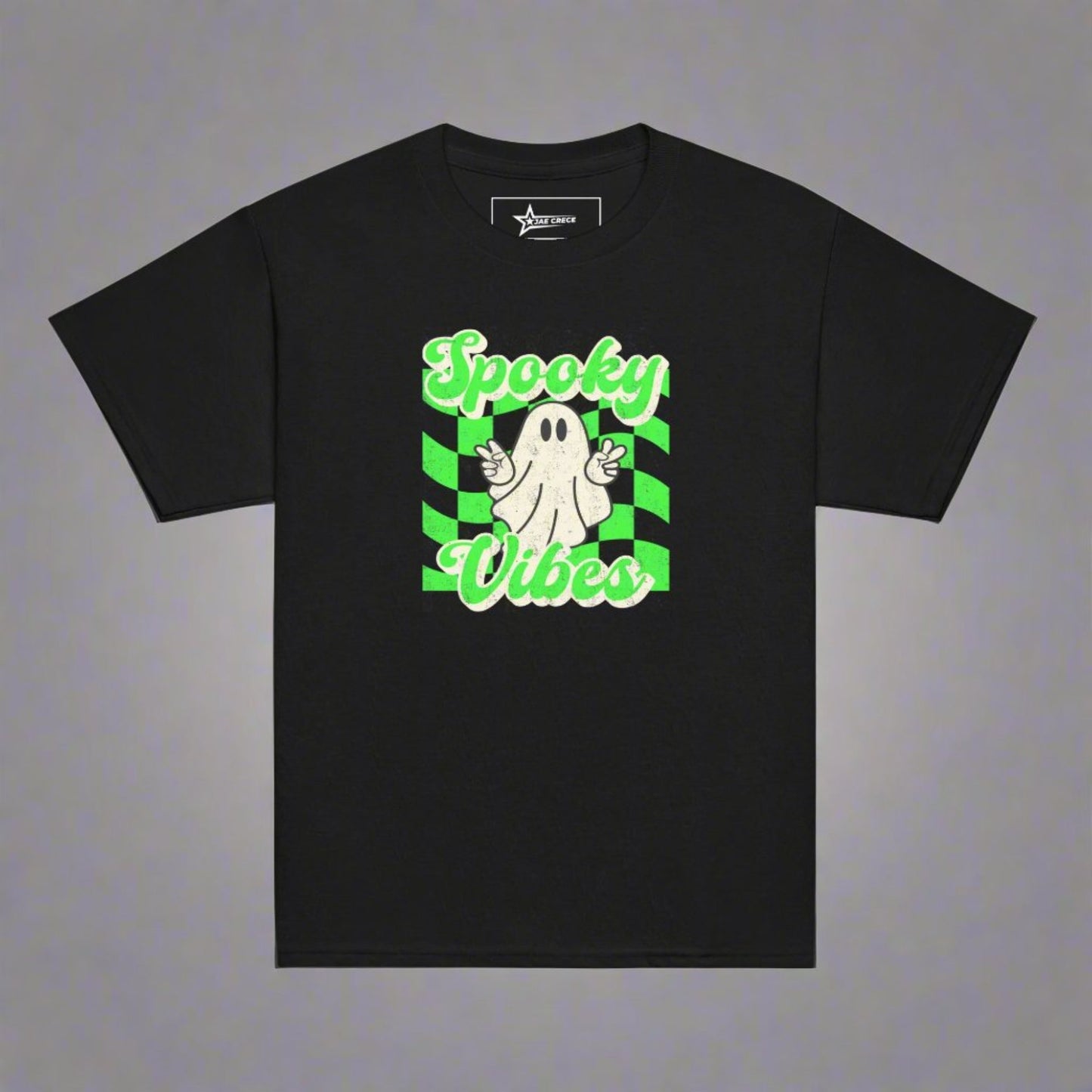 Black Spooky Vibes Child Shirt with a bright green checkerboard pattern and a cute ghost showing the peace sign. The text reads Spooky Vibes. This Halloween tee is perfect for girls and boys! By jaecrece