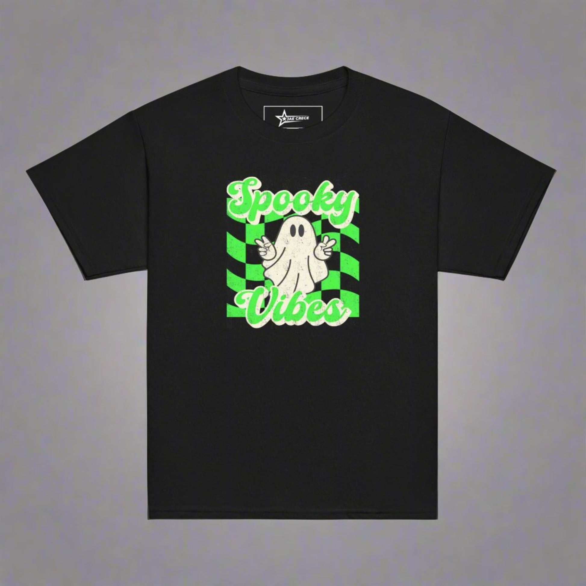 Black Spooky Vibes Child Shirt with a bright green checkerboard pattern and a cute ghost showing the peace sign. The text reads Spooky Vibes. This Halloween tee is perfect for girls and boys! By jaecrece