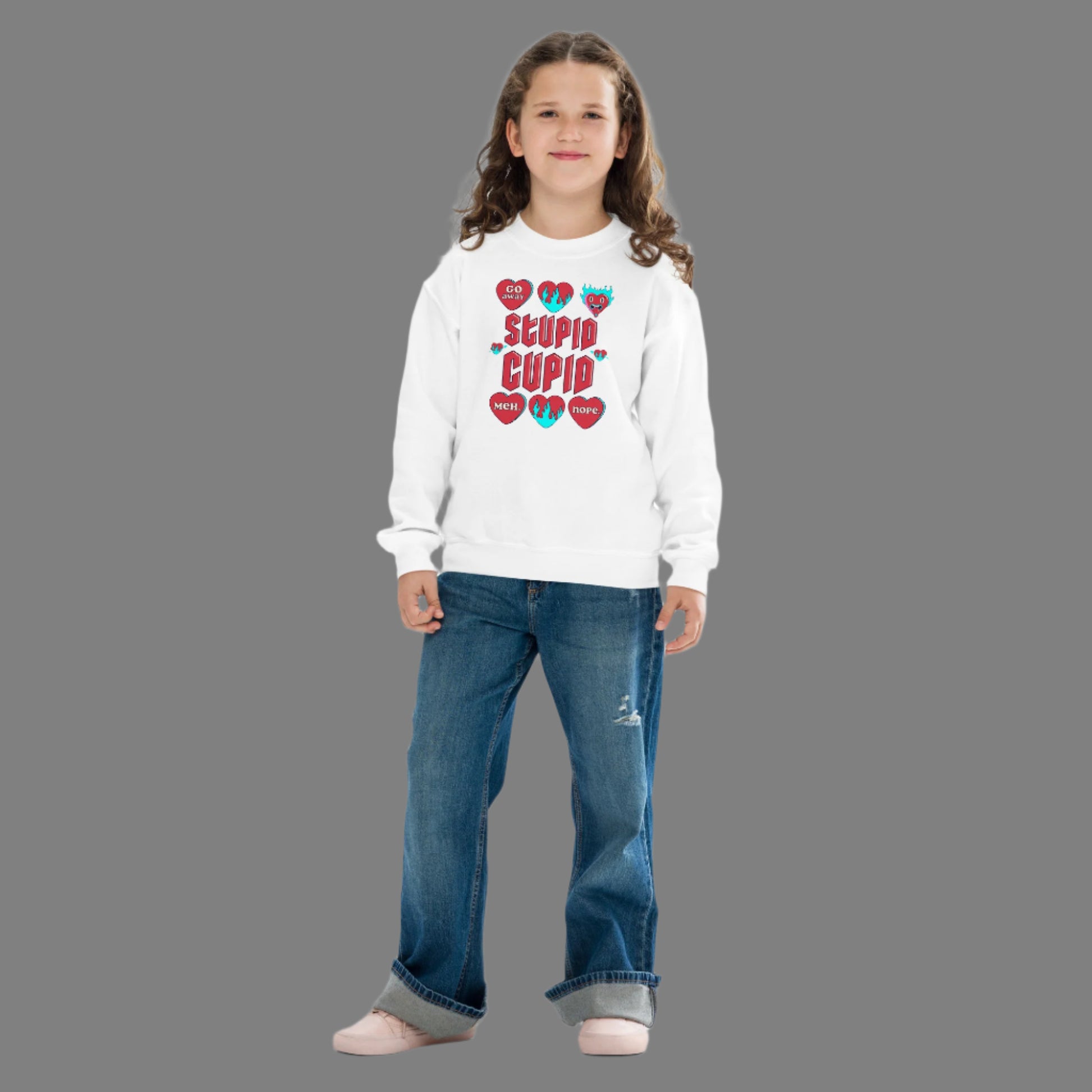 Image: Stupid Cupid Anti Valentines Day T-shirt for Kids. This sweatshirt is for girls and boys with red 90s style text that reads Stupid Cupid, with conversation hearts that are on fire, or say Go Away, Meh, Nope. Great for school party, by jaecrece