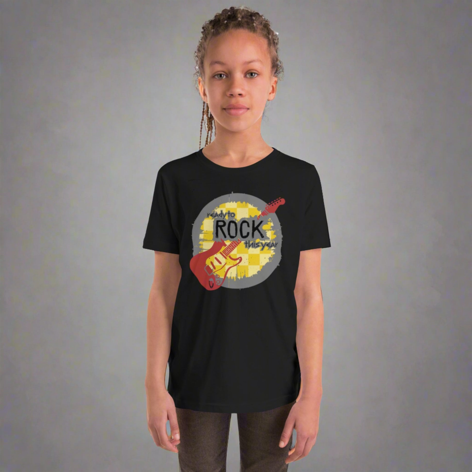 Black youth unisex tshirt, with a mustard yellow checkerboard background. Maroon guitar. The rock and roll font reads "Ready to rock this year", by jaecrece.com