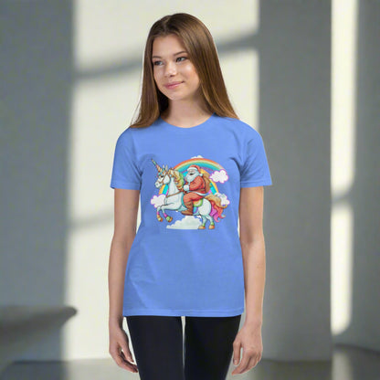 Alt Text: Blue short sleeve youth tshirt, featuring a whimsical scene of Santa riding on a unicorn over a rainbow with clouds